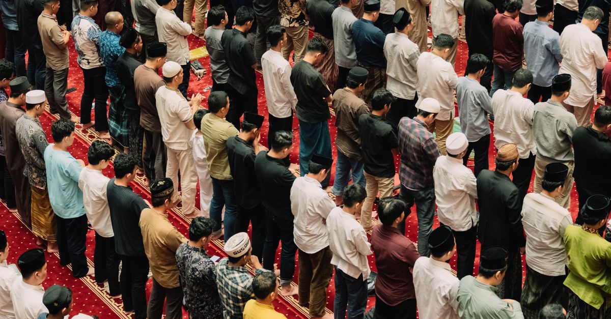 Muslims gathered inside a mosque for prayer, showing unity and devotion in Islamic practice.